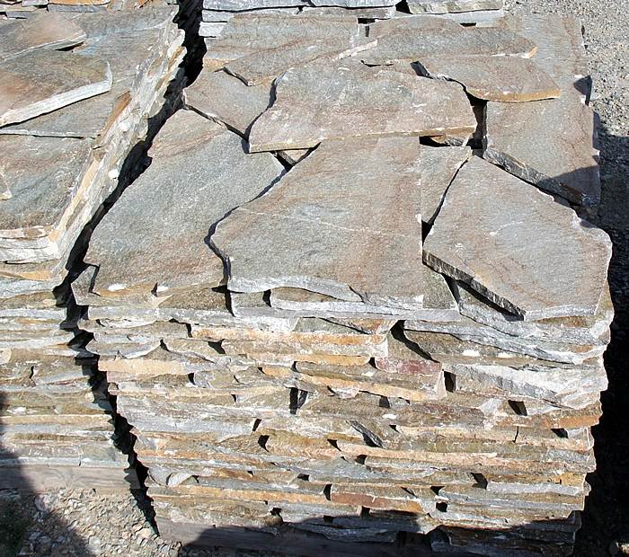 Terra Brown stone slabs stacked on a pallet