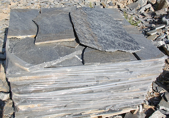 Terra Grey stone slabs stacked on a pallet