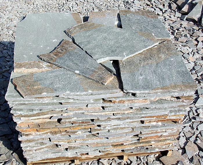 Terra Mixed stone slabs stacked on a pallet